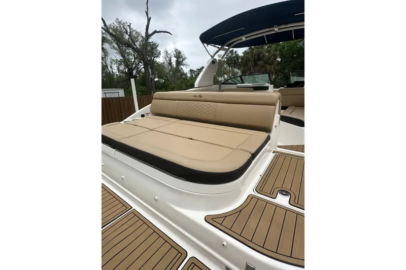 Slide: The Image of 2019 Sea Ray SDX 270 Outboard boat with tan seating and teak-style flooring. - 22