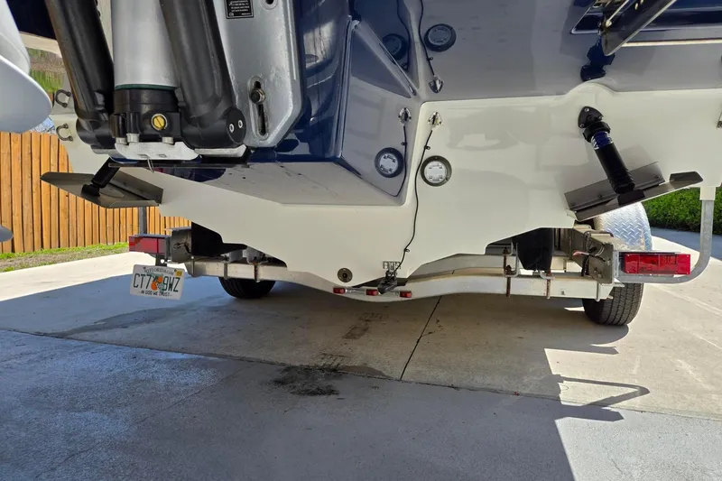 Slide: The Image of Rear view of a 2019 Sea Ray SDX 270 Outboard on a trailer. - 26