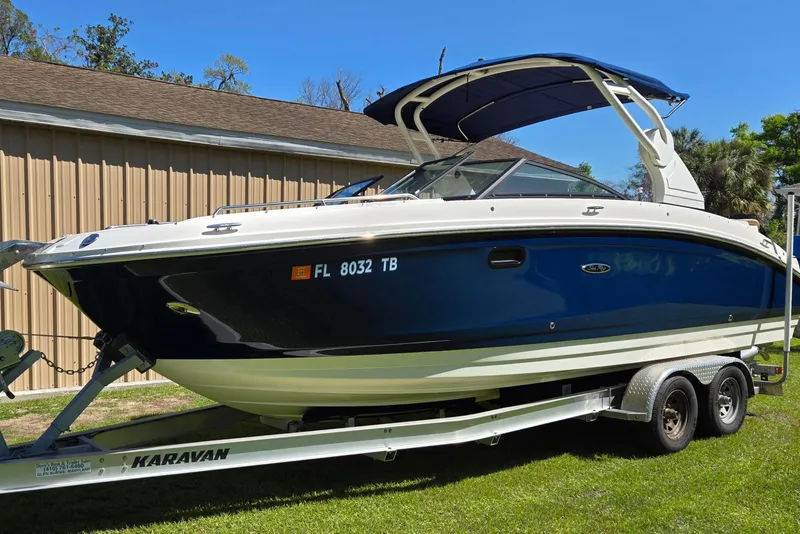 Slide: The Image of 2019 Sea Ray SDX 270 Outboard boat on trailer, parked outdoors. - 5