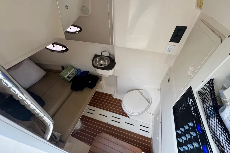 Slide: The Image of 2019 Scout 300 LXF cabin interior with seating, sink, and toilet. - 6