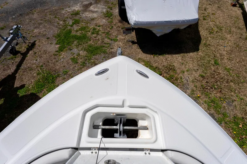 Slide: The Image of Bow view of a 2020 Clearwater 2200 boat on grassy terrain. - 10