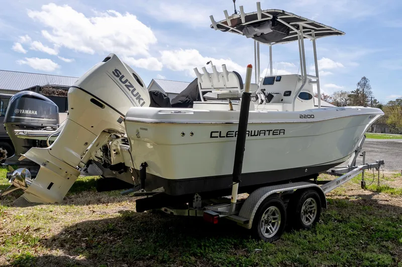 Slide: The Image of 2020 Clearwater 2200 boat with Suzuki outboard engine on a trailer. - 3