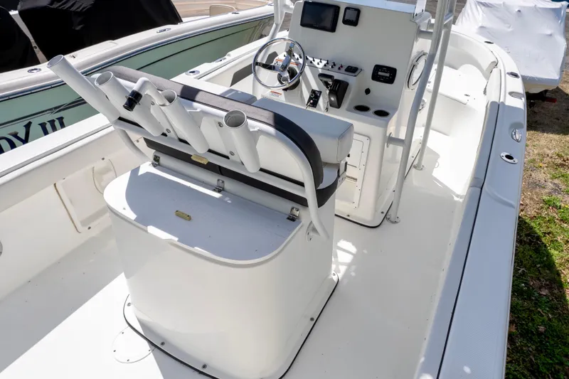 Slide: The Image of 2020 Clearwater 2200 boat interior with steering console and rod holders. - 6