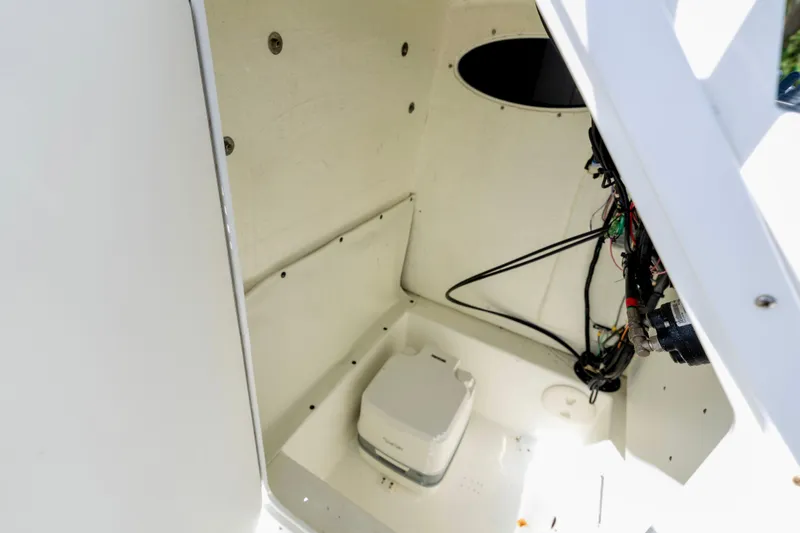 Slide: The Image of Interior view of a 2020 Clearwater 2200 boat compartment with wiring and equipment. - 8