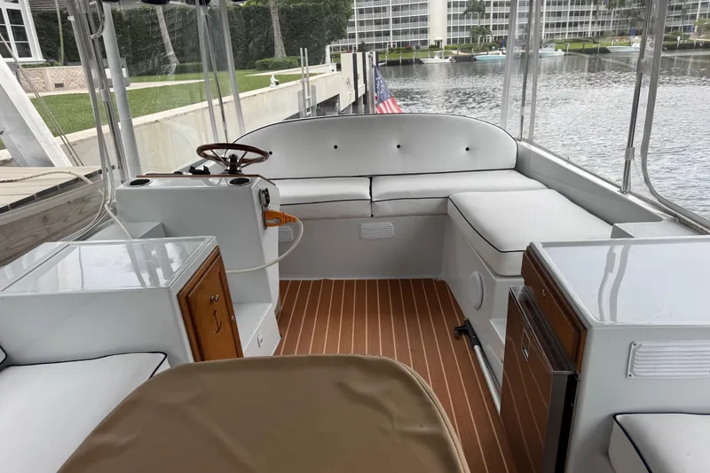Slide: The Image of 2023 Duffy Bay Island 22 boat interior with seating and wooden flooring. - 6