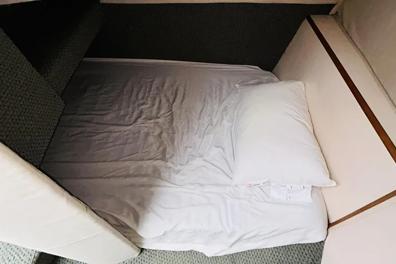 Slide: The Image of Cozy cabin bed inside 1988 Sea Ray 265 Sedan Bridge boat. - 11