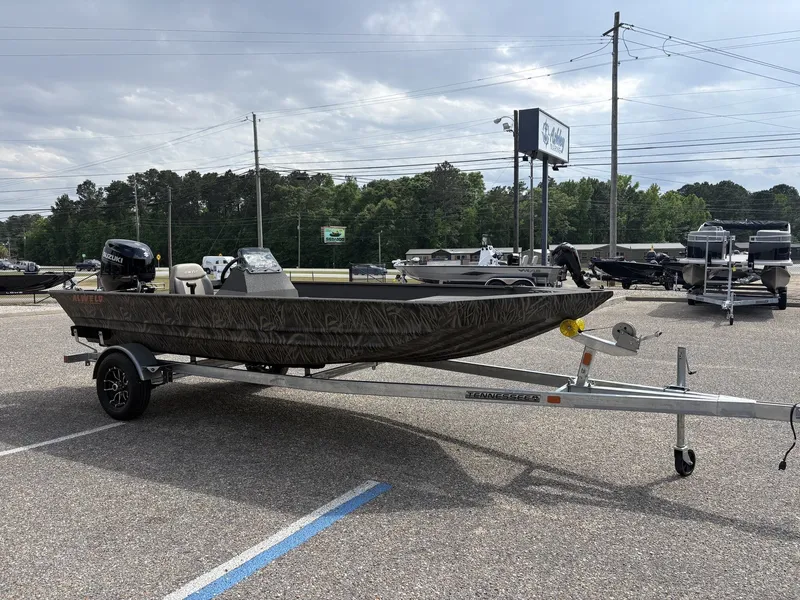 The Image of 2026 Alweld 1860VV Marsh Console boat on trailer outdoors. - 1
