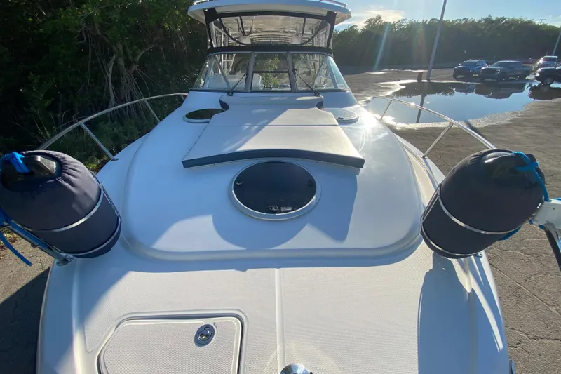 Slide: The Image of 2009 Century 3200 Offshore boat deck with fenders, docked in sunlight. - 14