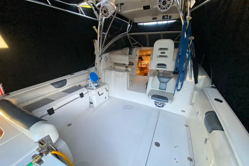 Slide: The Image of 2009 Century 3200 Offshore boat interior with seating and storage compartments. - 16