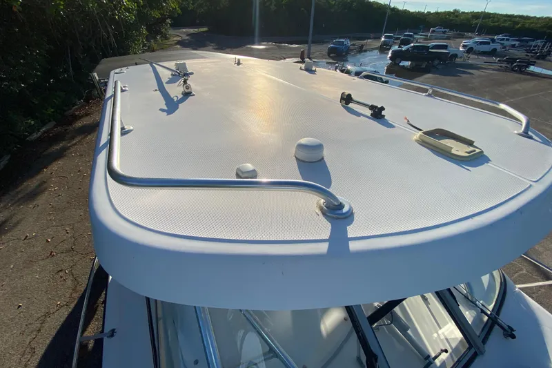 Slide: The Image of 2009 Century 3200 Offshore boat roof with railing in a parking lot. - 40
