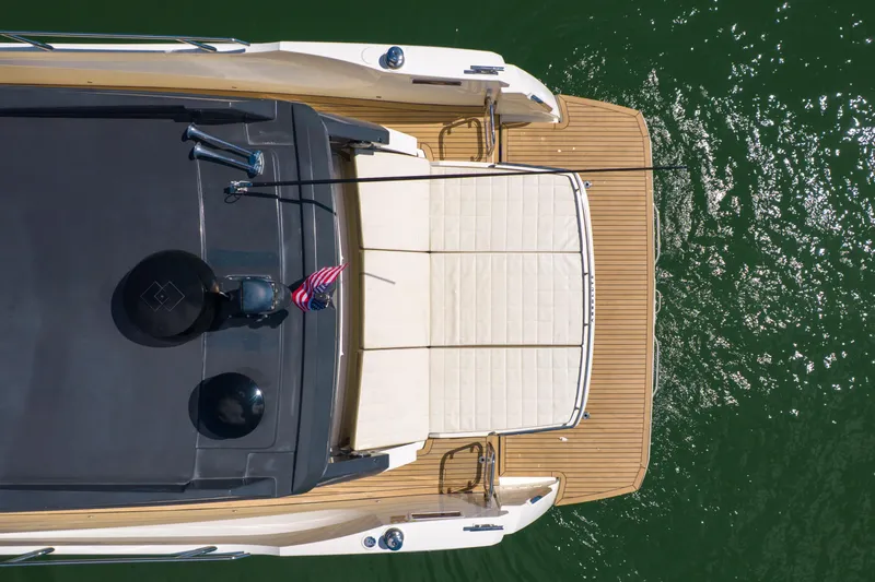 Slide: The Image of Top view of 2017 Absolute 40 STL yacht on green water. - 10