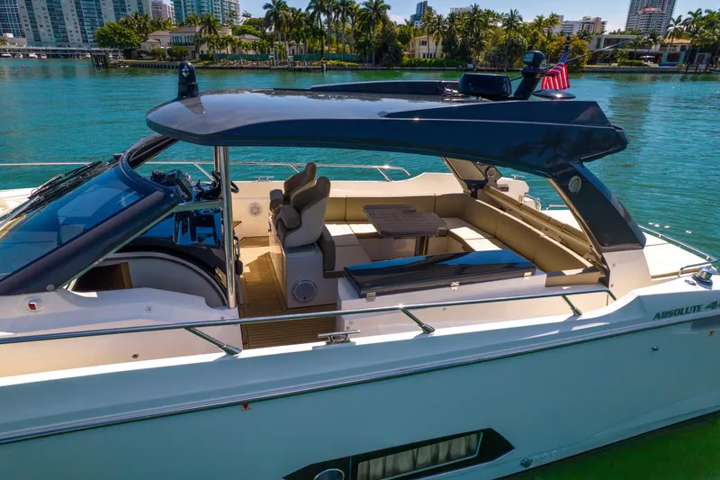 Slide: The Image of Luxurious 2017 Absolute 40 STL yacht docked, featuring sleek design and spacious seating area. - 11
