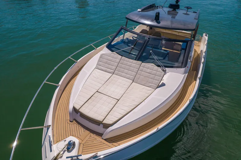 Slide: The Image of Luxury 2017 Absolute 40 STL yacht with spacious sunbathing deck on calm water. - 14