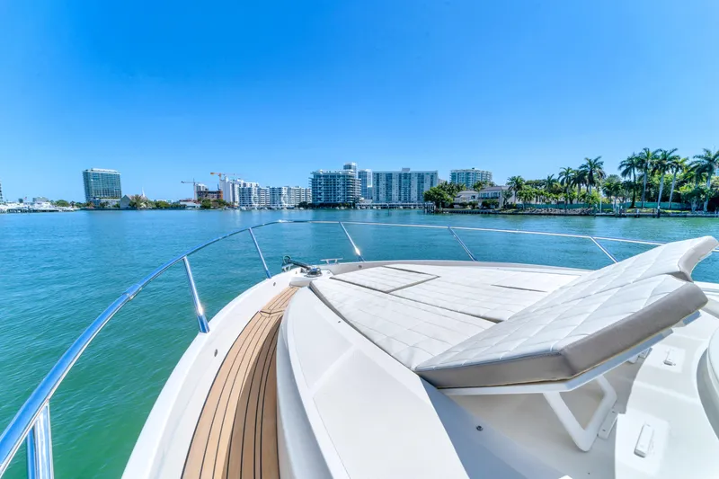Slide: The Image of Luxury yacht Absolute 40 STL 2017 cruising near waterfront cityscape under clear blue sky. - 18