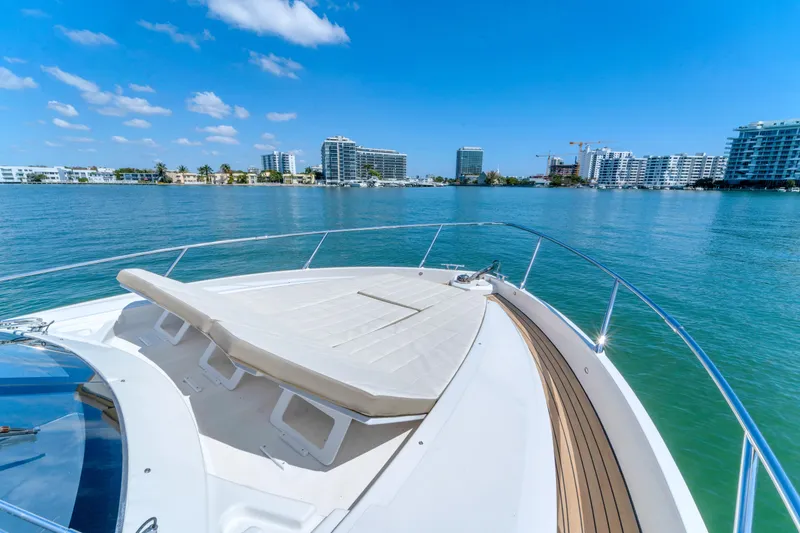Slide: The Image of Luxury yacht Absolute 40 STL cruising near city skyline, clear blue water, sunny day, 2017 model. - 19