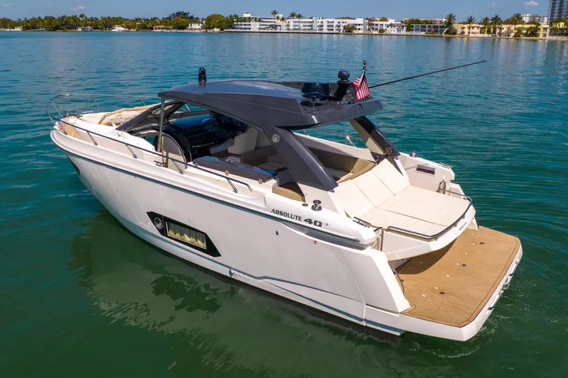 Slide: The Image of Luxury 2017 Absolute 40 STL yacht cruising on serene waters. - 2