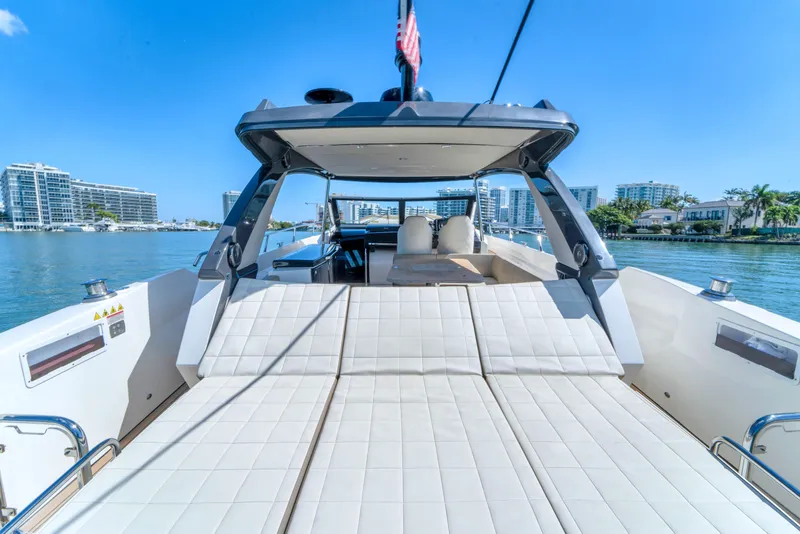 Slide: The Image of Luxury Absolute 40 STL yacht, 2017 model, cruising on a sunny day with cityscape views. - 21