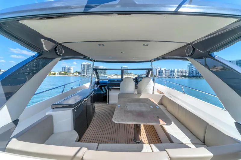 Slide: The Image of Luxurious 2017 Absolute 40 STL yacht interior with seating and table, overlooking waterfront skyline. - 23