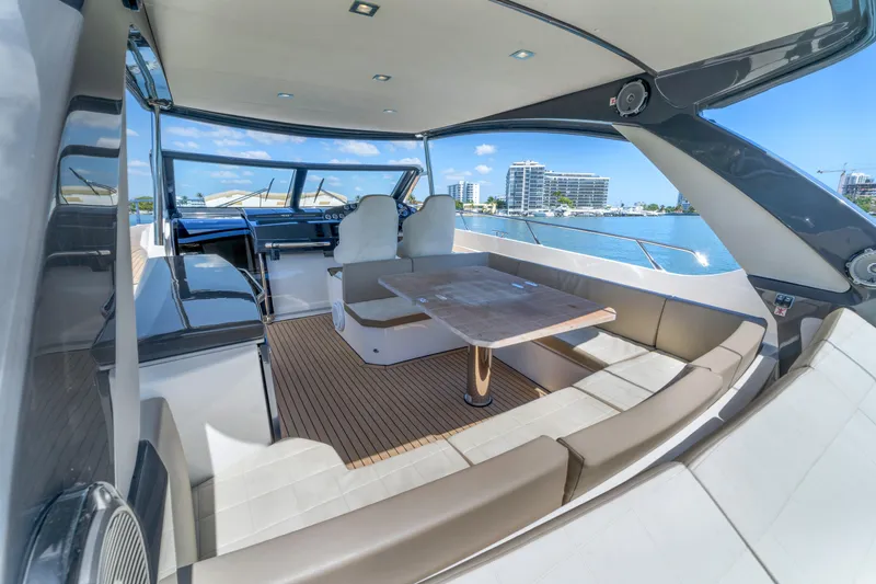 Slide: The Image of Luxurious 2017 Absolute 40 STL yacht interior with seating and table, overlooking waterfront views. - 24
