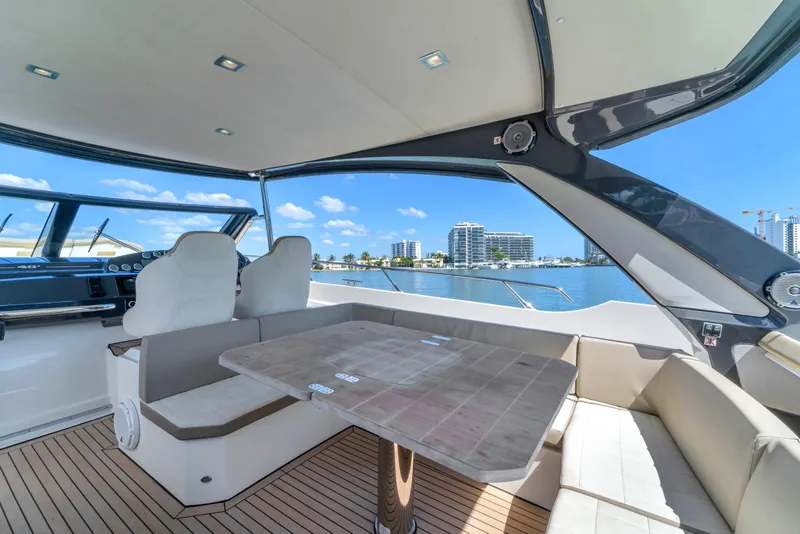 Slide: The Image of Luxurious 2017 Absolute 40 STL yacht interior with seating and scenic waterfront view. - 25