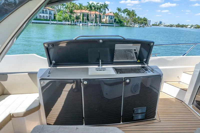 Slide: The Image of Outdoor kitchen on 2017 Absolute 40 STL yacht with scenic waterfront view. - 28