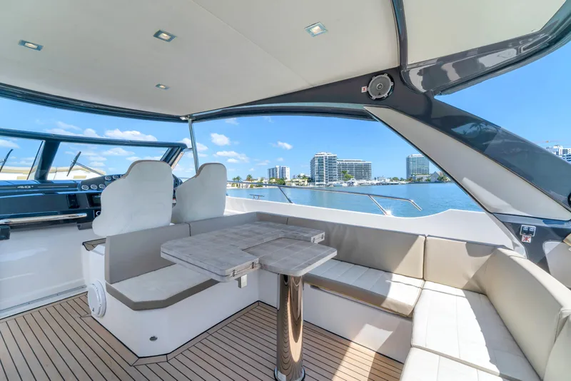 Slide: The Image of Luxurious 2017 Absolute 40 STL yacht interior with seating and scenic waterfront view. - 29