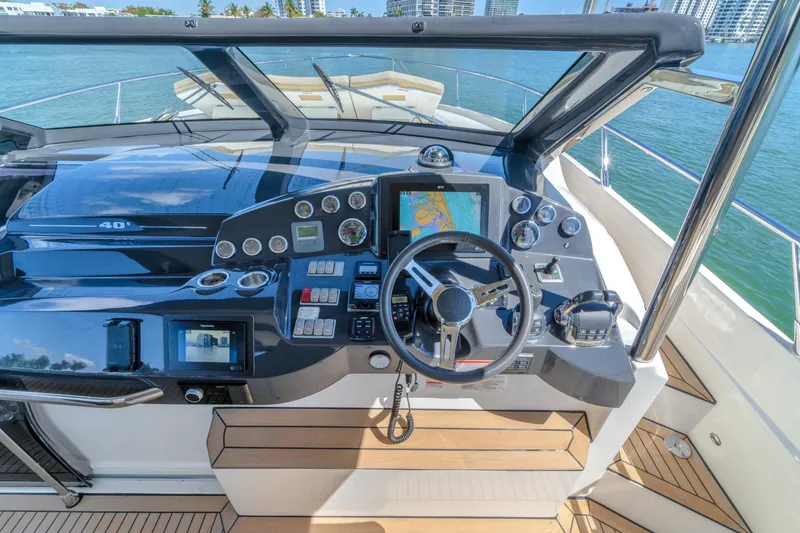 Slide: The Image of Cockpit of 2017 Absolute 40 STL yacht with navigation controls and steering wheel. - 34