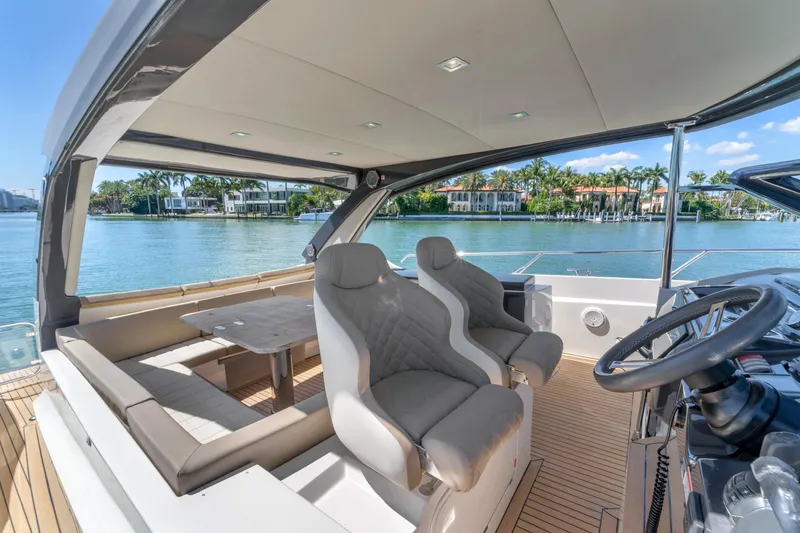 Slide: The Image of Luxurious 2017 Absolute 40 STL yacht interior with plush seating and scenic waterfront view. - 37