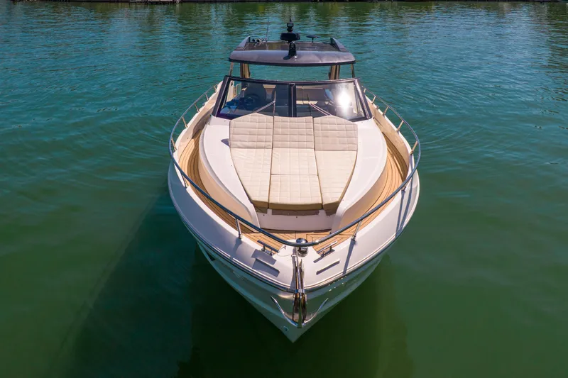 Slide: The Image of 2017 Absolute 40 STL yacht on calm water, showcasing sleek design and spacious deck. - 4