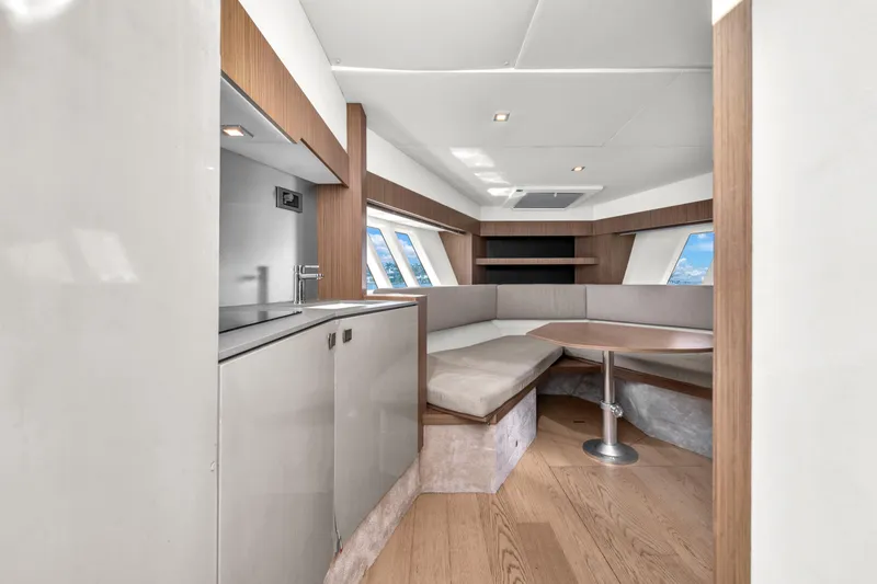 Slide: The Image of Luxurious interior of 2017 Absolute 40 STL yacht with modern seating and kitchenette. - 42