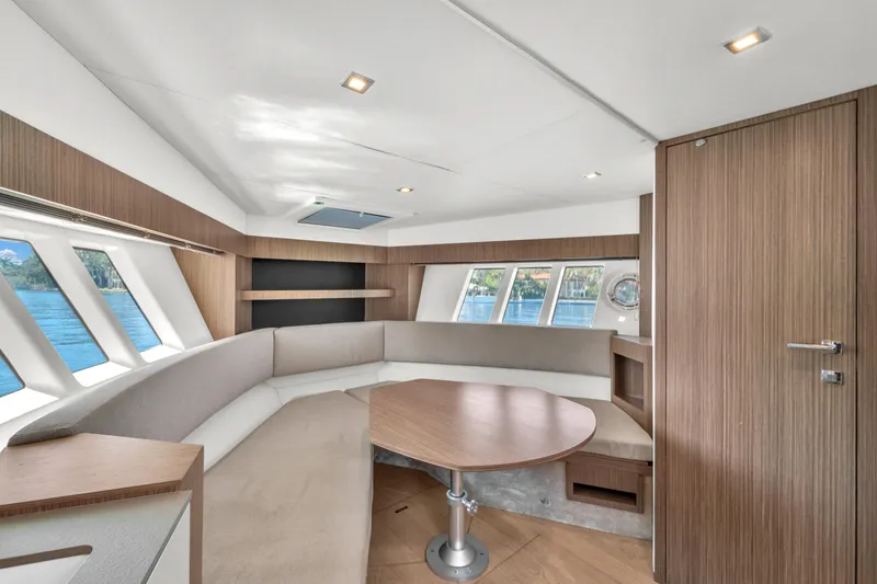 Slide: The Image of Luxurious interior of 2017 Absolute 40 STL yacht with modern seating and panoramic windows. - 47