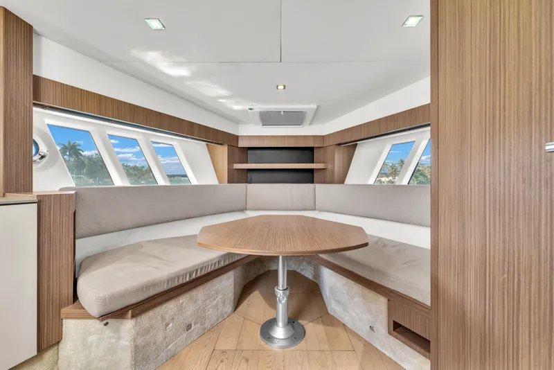 Slide: The Image of Luxurious interior of 2017 Absolute 40 STL yacht with elegant wood finishes and panoramic windows. - 48