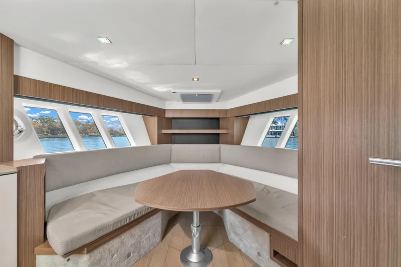 Slide: The Image of Luxurious interior of 2017 Absolute 40 STL yacht with panoramic windows and elegant seating. - 49