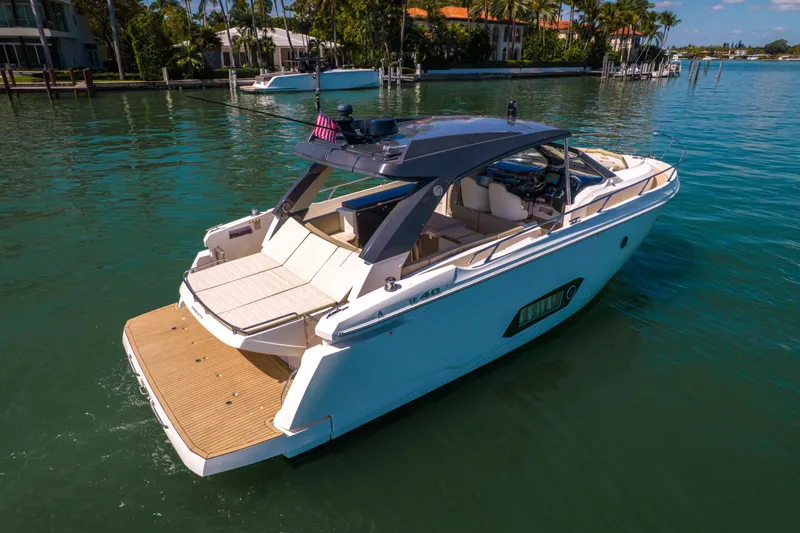 Slide: The Image of Luxury 2017 Absolute 40 STL yacht cruising in serene waters near waterfront homes. - 5