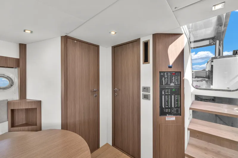 Slide: The Image of Interior of 2017 Absolute 40 STL yacht with wooden doors and control panel. - 51