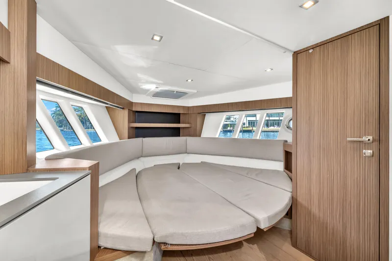 Slide: The Image of Luxurious interior of 2017 Absolute 40 STL yacht with modern seating and wood accents. - 55