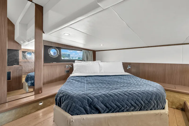 Slide: The Image of Luxurious cabin interior of 2017 Absolute 40 STL yacht with cozy bed and porthole view. - 58