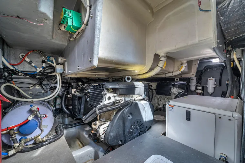 Slide: The Image of Engine room of a 2017 Absolute 40 STL yacht, showcasing machinery and wiring. - 61