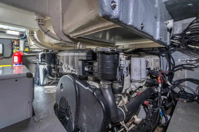Slide: The Image of Engine room of 2017 Absolute 40 STL yacht, showcasing mechanical components and wiring. - 63