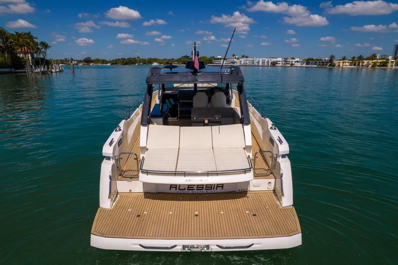 Slide: The Image of Rear view of a 2017 Absolute 40 STL yacht on calm waters under a blue sky. - 7