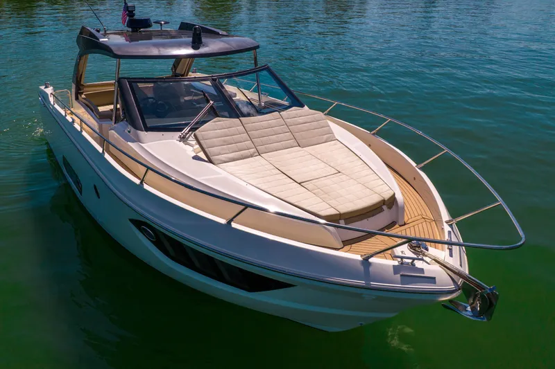 Slide: The Image of 2017 Absolute 40 STL yacht on calm water, featuring sleek design and spacious deck. - 74