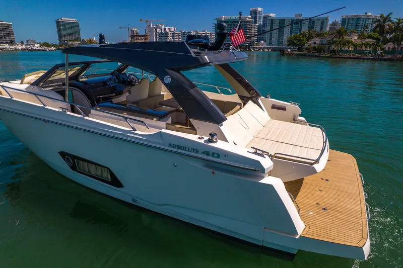 Slide: The Image of Luxury Absolute 40 STL yacht from 2017 docked in a scenic marina. - 76