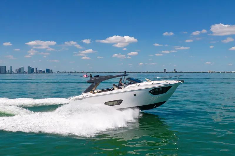 Slide: The Image of 2017 Absolute 40 STL yacht cruising on clear blue waters under a sunny sky. - 79