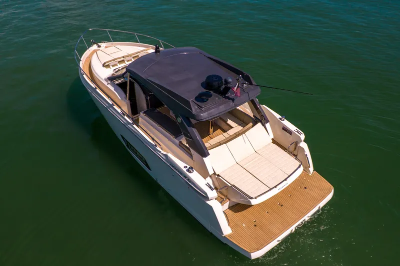 Slide: The Image of Luxury 2017 Absolute 40 STL yacht cruising on calm green waters. - 8