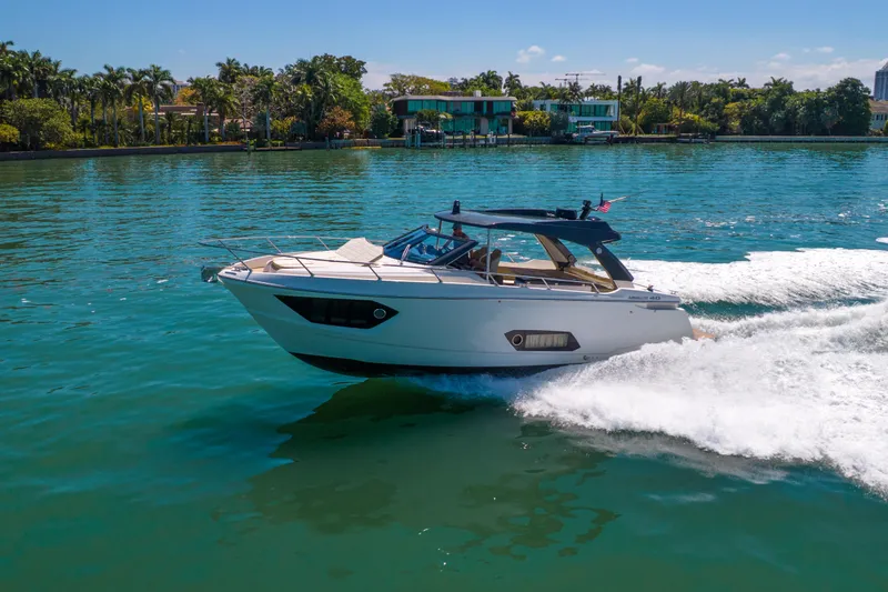 Slide: The Image of 2017 Absolute 40 STL yacht cruising on a sunny day in a scenic waterway. - 82
