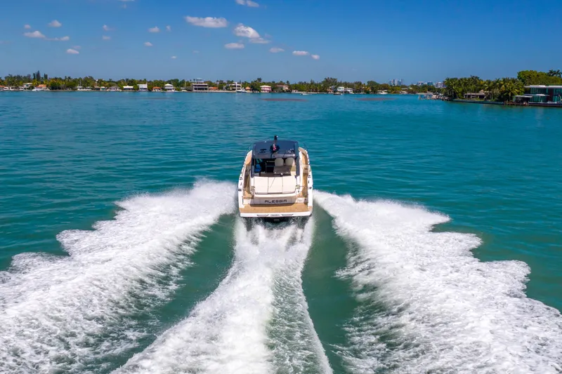 Slide: The Image of Luxury Absolute 40 STL yacht cruising on clear blue water, 2017 model. - 86