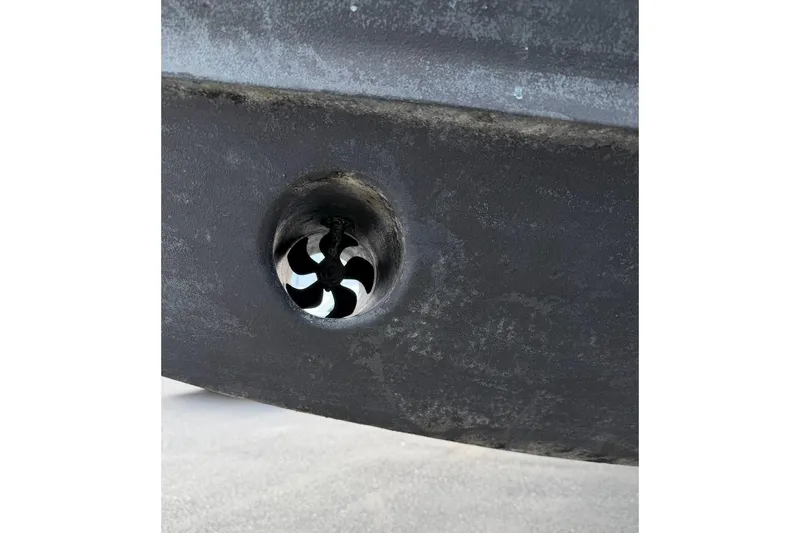 Slide: The Image of Close-up of a 2020 Grady-White Freedom 285 boat hull with a visible thruster. - 3