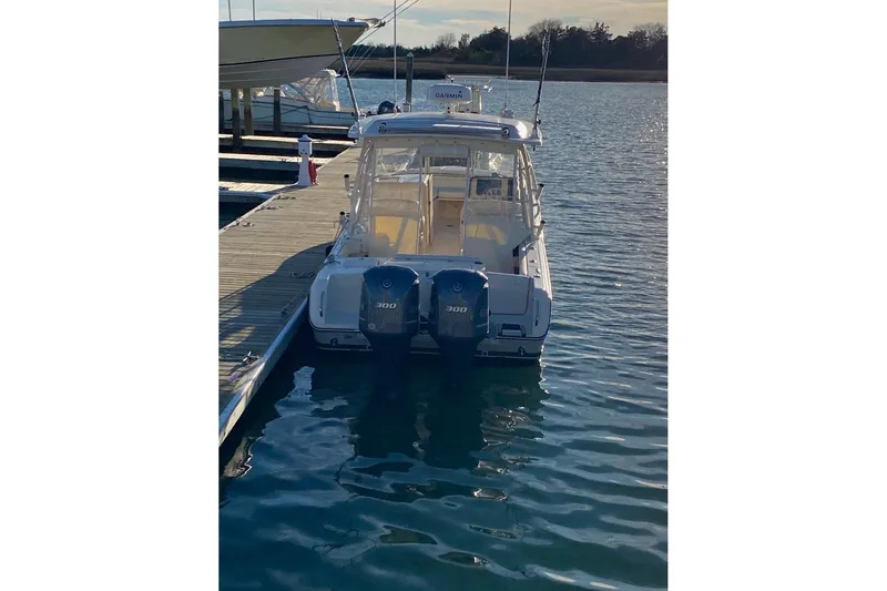 Slide: The Image of 2020 Grady-White Freedom 285 boat docked with twin 300 horsepower engines. - 4