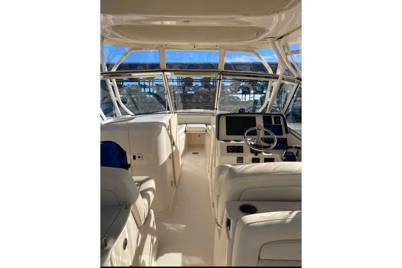 Slide: The Image of Interior view of 2020 Grady-White Freedom 285 boat cockpit with steering wheel and controls. - 5