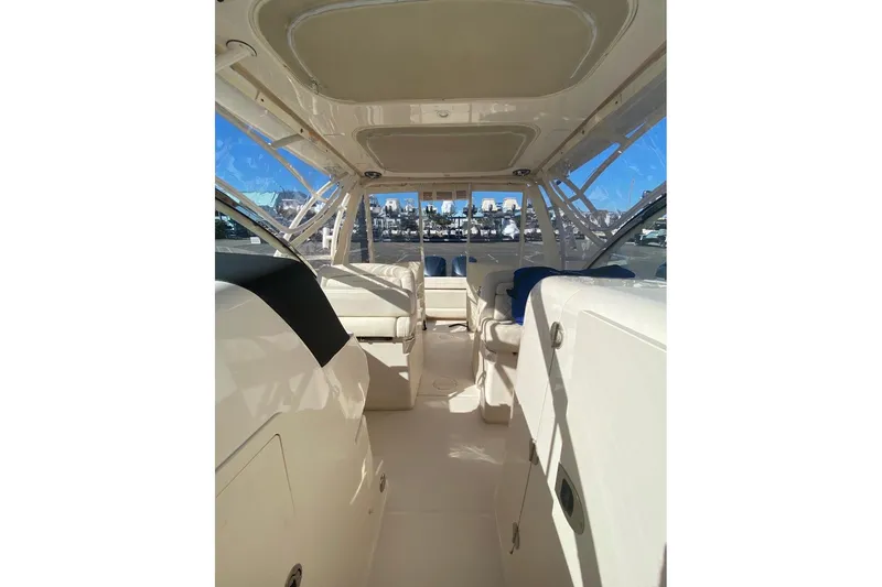 Slide: The Image of 2020 Grady-White Freedom 285 boat interior with seating and clear windows. - 6